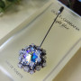Брошка на шпажці з кристалом Swarovski та натуральним камінням лабрадору