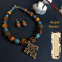 Комплект намисто і сережки з бурштину і тигрового ока та згардою "Відкриті почуття"